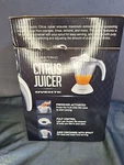 Ovente Electric Citrus Juicer Orange Lemon Lime Grapefruit Ounce JEI034 White. Fixed Price $24.99.