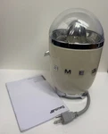 Demo Model Smeg 50'S Retro Style Electric Juicer, Cream SCJ-C04. Fixed Price $149.95.