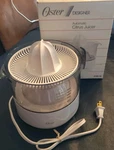 Vtg 1988 Oster Automatic Citrus Juicer Model 4140-18. Fixed Price $48.45.